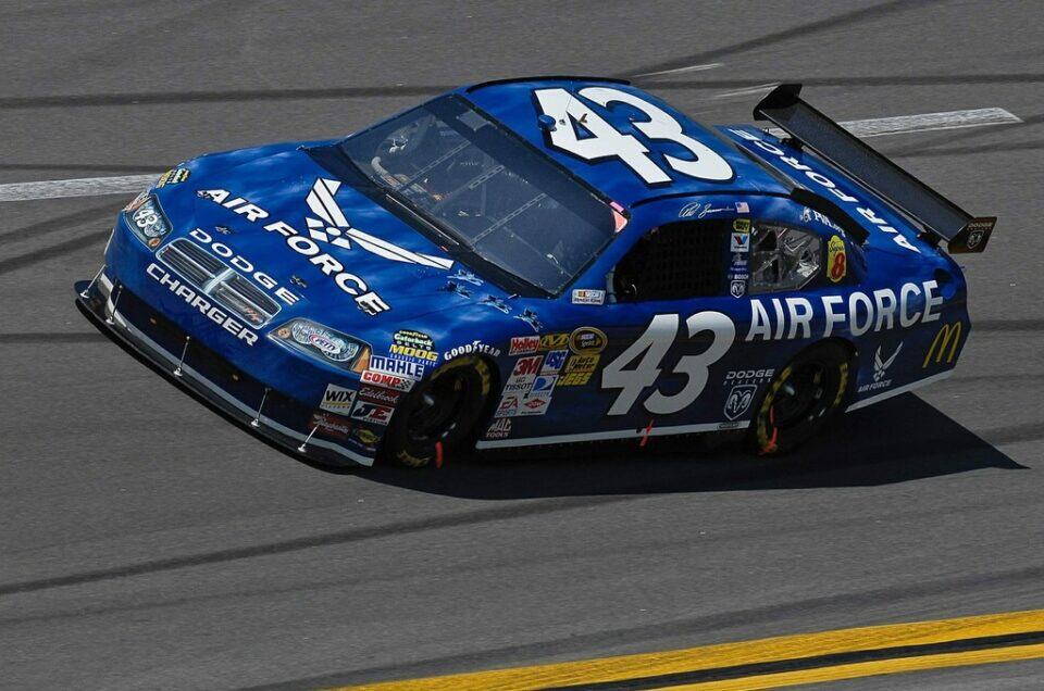 Race car with Air Force sponsorship and number 43, showcasing high-speed racing.