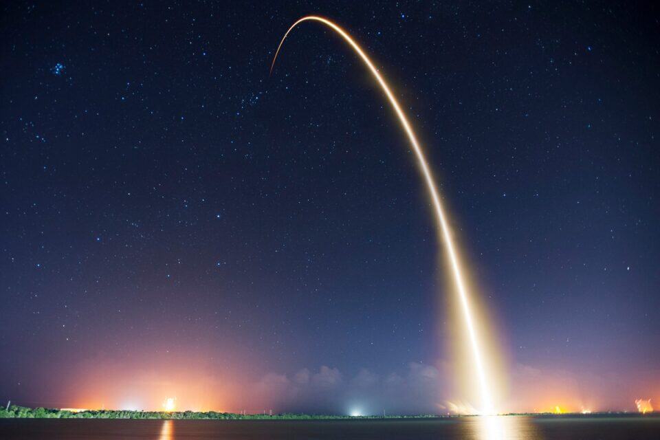 High-quality image of a rocket launch with vibrant trail for golf equipment advertising.